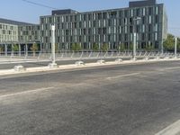 a bench is sitting in the middle of the road next to a highway with traffic lights