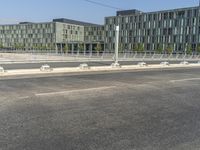 a bench is sitting in the middle of the road next to a highway with traffic lights