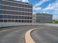 a car is driving on the highway through an underground parking garage area in a city