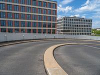 a car is driving on the highway through an underground parking garage area in a city