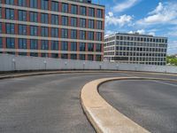 a car is driving on the highway through an underground parking garage area in a city