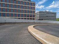 a car is driving on the highway through an underground parking garage area in a city