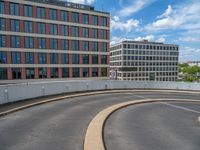 a car is driving on the highway through an underground parking garage area in a city