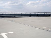 a boat is parked in an empty parking lot near an air port on the water