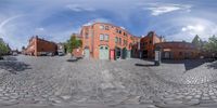 a 360 - view photo shows a city square with the building and its surrounding entrance