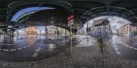 this is a 360 - view photo taken in the city streets of a town as it is reflected by the street lights