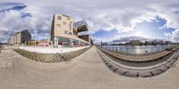 fisheye image of a modern architecture designed for the camera, taken on the waterfront