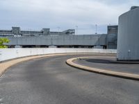 a car is driving on the highway through an underground parking garage area in a city