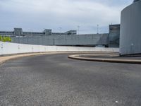 a car is driving on the highway through an underground parking garage area in a city