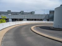 a car is driving on the highway through an underground parking garage area in a city