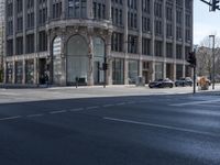 a view of the street with buildings and car, with motion bluring in the foreground