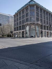 a view of the street with buildings and car, with motion bluring in the foreground