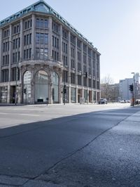 a view of the street with buildings and car, with motion bluring in the foreground