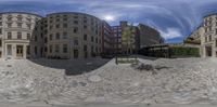 the photo appears to be 360 - eye view of an empty city street, with cobblestones