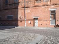 Berlin, Germany: Cobblestone Road and Brick Building 001