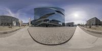 360 - view of a modern building with a curved curved street in front of it