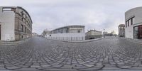 a 360 - pano image of an empty street and buildings in a town street