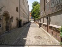 empty cobblestones with no one going down the street in a small town area