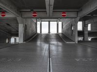 an empty parking garage with no people or vehicles in it and sign indicating no parking inside