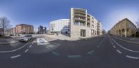 the camera has been positioned as if to show a curve down an empty street and building behind