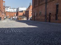 there are many people walking down this street to get their picture taken by the camera