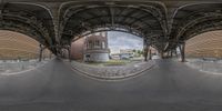 the view from a fish eye lens at an old train station with brick buildings in the background