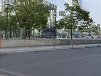 a truck parked at the curb on an empty street next to trees and other building