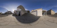 a view of a big stone building from a fish - eye lens of the building