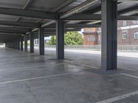 this photo is an empty building that has been converted to a parking lot for public transportation