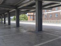 this photo is an empty building that has been converted to a parking lot for public transportation