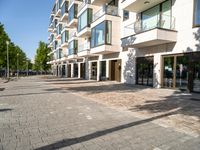 a large building has many windows and doors on both sides of the walkways, which also look very nice