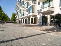 a large building has many windows and doors on both sides of the walkways, which also look very nice