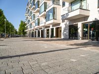 a large building has many windows and doors on both sides of the walkways, which also look very nice