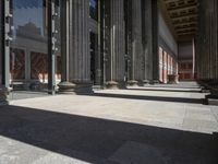 an open and empty building with several columns in it in a sunny day with blue sky