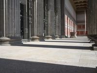 an open and empty building with several columns in it in a sunny day with blue sky