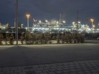 a long exposure view of the power plant at night in the foggy, outcropped area