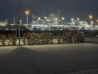 a long exposure view of the power plant at night in the foggy, outcropped area