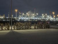 a long exposure view of the power plant at night in the foggy, outcropped area