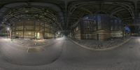 three different views of the inside of a building at night, looking down on a street