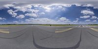 a camera panoramic shot of an airport runway with clouds in the background and a fire hydrant nearby