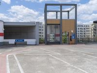 a parking lot with a bus and car at the entrance of a building or office