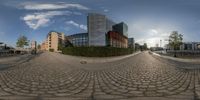 a fish eye image with the city's buildings and trees in the background in this 360 - view