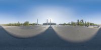 a fish - eye lens image of a person in the sun on a skateboard