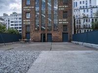 an empty parking lot with a sign that reads brick lane and the name park on it