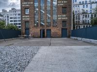 an empty parking lot with a sign that reads brick lane and the name park on it