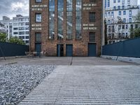 an empty parking lot with a sign that reads brick lane and the name park on it