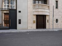 a motorcycle parked in front of a tall building on the street with its doors open