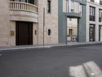 a motorcycle parked in front of a tall building on the street with its doors open