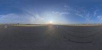 a plane is seen in this fish eye view of the tarmac on the runway