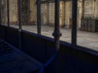 a view of the inside of a train station from the back of a bus driving by